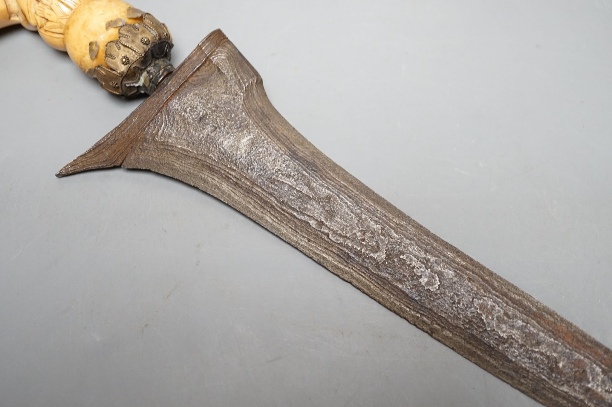 A 19th century ivory handled Kris, 40 cms long.